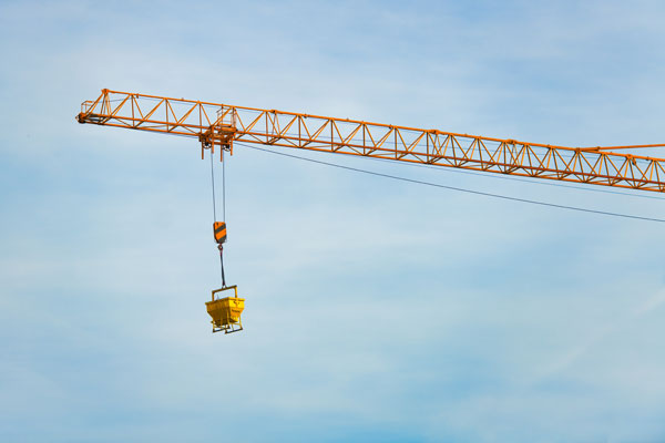 A chain hoist and a lattice boom of a tower crane