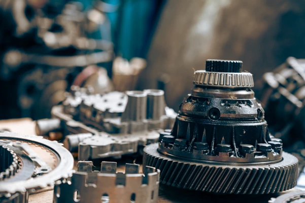 Close-up of a worn and greasy crane gearbox component